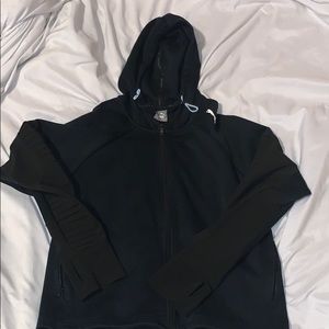 A black puma jacket in womans